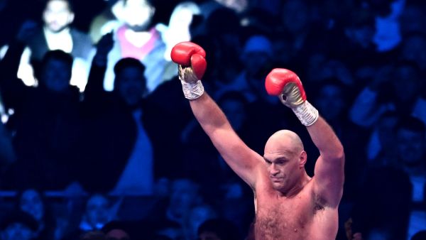 Britain's Tyson Fury reacts after the referee stops the fight against Britain's Derek Chisora during their WBC heavyweight title boxing match, at the Tottenham Hotspur stadium in east London, on December 3, 2022. (Photo by Ben Stansall / AFP)