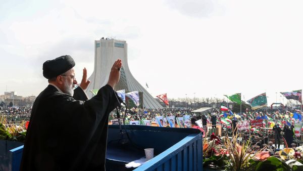A handout picture provided by the Iranian presidency shows President Ebrahim Raisi greeting the crowds gathered in Tehran's Azadi Square to mark the 44nd anniversary of the 1979 Islamic Revolution, on February 11, 2023. (Photo by Iranian Presidency / AFP) poisoning attacks