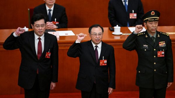  Li Shangfu swear an oath after they were elected during the fifth plenary session of the National People's Congress (NPC) at the Great Hall of the People in Beijing 