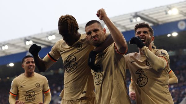 Chelsea's Croatian midfielder Mateo Kovacic (2R) celebrates scoring the team's third goal with Chelsea's English defender Trevoh Chalobah (2L) during the English Premier League football match between Leicester City and Chelsea at King Power Stadium in Leicester, central England on March 11, 2023. (Photo by Darren Staples / AFP)