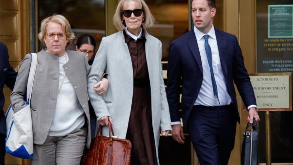 Writer E. Jean Carroll (C) leaves the Manhattan Federal Court in New York on April 25, 2023, as jury selection is set to begin in the defamation case against former US President Donald Trump brought by Carroll, who accused him of raping her in the 1990s. (Photo by KENA BETANCUR / AFP)