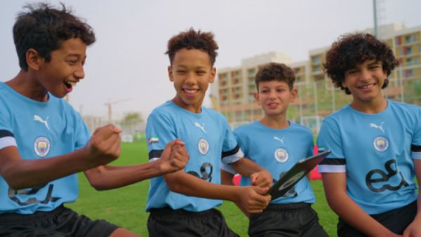e& and manchester city surprise talented player programme participants with opportunity of a lifetime