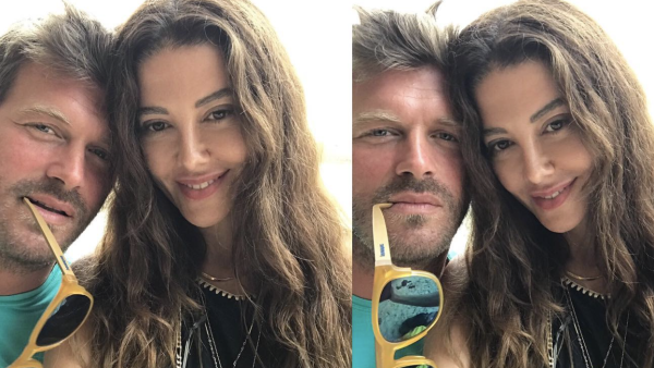 Kıvanç Tatlıtuğ gives his wife a kiss in rare snap