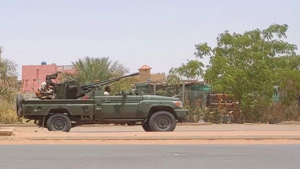 Fighters of the paramilitary Rapid Support Forces (RSF) drive an armoured vehicle in southern Khartoum. (Photo by AFP).  Rapid Support Forces