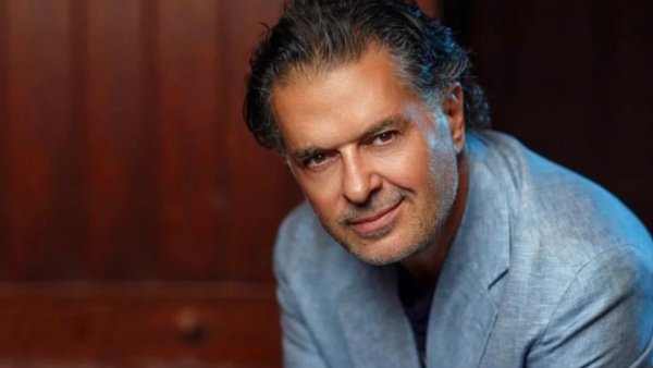 Ragheb Alama wears pink suit to support his son