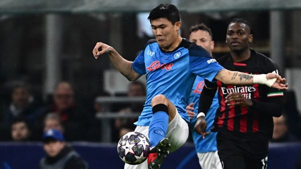 Napoli's South Korean defender Min-jae Kim clears a ball during the UEFA Champions League quarter-finals first leg football match between AC Milan and SSC Napoli on April 12, 2023 at the San Siro stadium in Milan. (Photo by GABRIEL BOUYS / AFP)