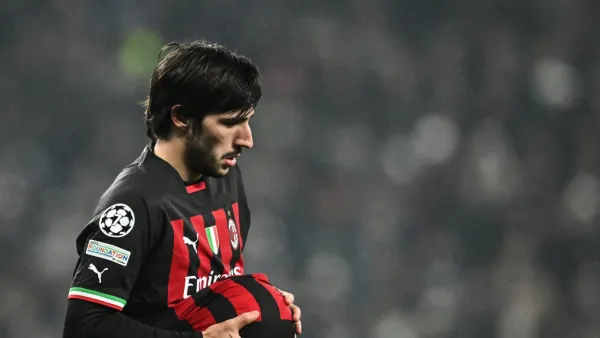 AC Milan's Italian midfielder Sandro Tonali cleans the ball during the UEFA Champions League round of 16 second-leg football match between Tottenham Hotspur and Milan AC at Tottenham Hotspur Stadium in London on March 8, 2023. (Photo by JUSTIN TALLIS / AFP)