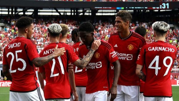Manchester United's English midfielder Jadon Sancho (L) celebrates scoring his team's first goal with teammates during the friendly football match between Manchester United and Arsenal at MetLife Stadium in East Rutherford, New Jersey, on July 22, 2023. (Photo by Leonardo Munoz / AFP)
