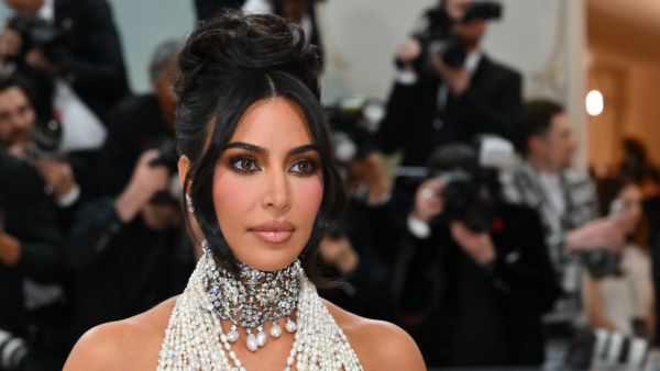 Kardashian is seen cradling a baby bump