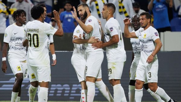 Ittihad's French forward Karim Benzema (C) celebrates with teammates after scoring his team's second goal during the 2023 Arab Club Champions Cup group A football match between Tunisia's Esperance de Tunis and Saudi Arabia's Al-Ittihad at the King Fahd Stadium in Taif on July 27, 2023. (Photo by AFP)
