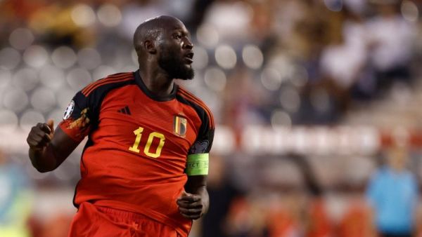Belgium's forward Romelu Lukaku scores the team's first goal during the UEFA Euro 2024 group F qualification football match between Belgium and Austria at the King Baudouin Stadium in Brussels, on June 17, 2023. (Photo by KENZO TRIBOUILLARD / AFP)