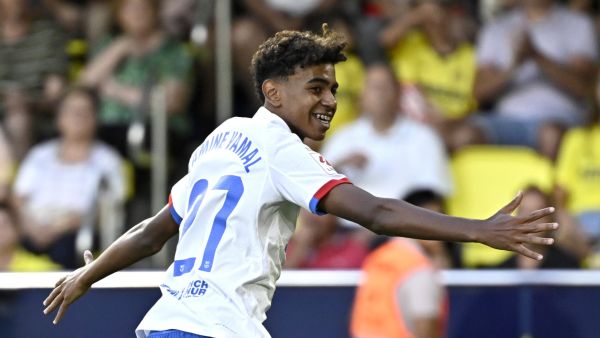 Barcelona's Spanish forward #27 Lamine Yamal celebrates after Barcelona's Polish forward #09 Robert Lewandowski (not seen) scored during the Spanish Liga football match between Villarreal CF and FC Barcelona at La Ceramica stadium in Vila-real on August 27, 2023. (Photo by JAVIER SORIANO / AFP)