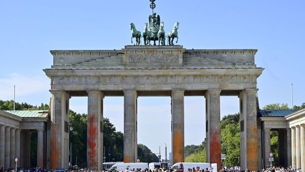 JOHN MACDOUGALL/AFP Brandenburg gate painted in protest