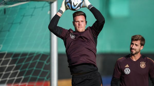 Germany's goalkeeper Marc-Andre Ter Stegen (L) and Germany's goalkeeper Kevin Trapp take part in a training session, on the eve of the friendly football match between Germany and Japan, at a training ground of the Volkswagen Arena in Wolfsburg, central Germany, on September 8, 2023. (Photo by Ronny Hartmann / AFP)
