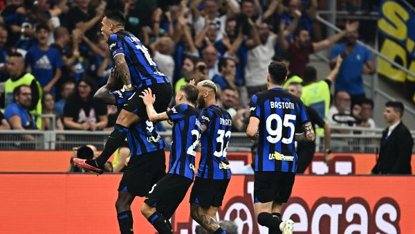 Inter Milan's French forward #09 Marcus Thuram (Bottom L) celebrates with teammates after scoring his team's second goal during the Italian Serie A football match between Inter Milan and AC Milan at the San Siro Stadium in Milan on September 16, 2023. (Photo by GABRIEL BOUYS / AFP)