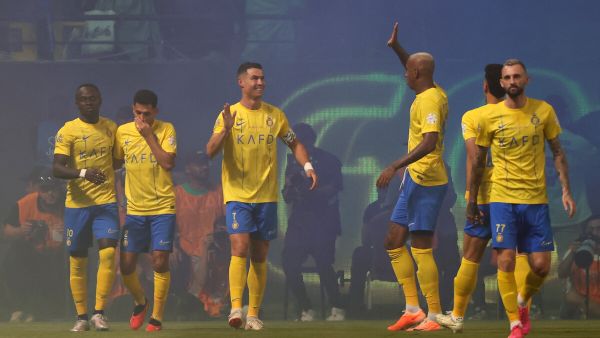 Nassr's players celebrate scoring during the Saudi Pro League football match between Al-Nassr and Al-Ahli at the King Saud University Stadium in Riyadh, on September 22, 2023. (Photo by Fayez NURELDINE / AFP)
