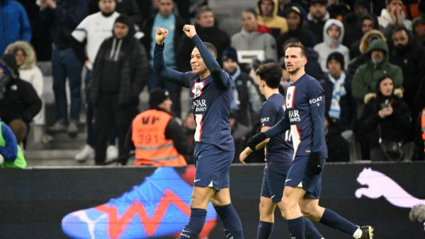 Paris Saint-Germain's French forward Kylian Mbappe celebrates after scoring his team's third goal during the French L1 football match between Olympique Marseille (OM) and Paris Saint-Germain (PSG) at the Velodrome stadium in Marseille, southern France on February 26, 2023. (Photo by CHRISTOPHE SIMON / AFP)