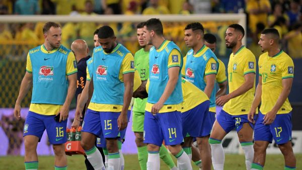 Brazilian players react at the end of the 2026 FIFA World Cup South American qualification football match between Brazil and Venezuela at the Arena Pantanal stadium in Cuiaba, Mato Grosso State, Brazil, on October 12, 2023. (Photo by NELSON ALMEIDA / AFP)