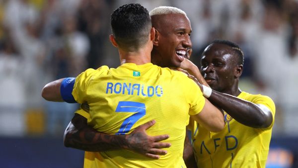 Nassr's Brazilian forward #94 Talisca (C) celebrates after scoring a goal with teammates Nassr's Portuguese forward #07 Cristiano Ronaldo and Nassr's Senegalese Forward #10 Sadio Mane (R) during the AFC Champions League Group E football match between Saudi's al-Nassr and Qatar’s al-Duhail at the King Saud University Stadium in Riyadh on October 24, 2023. (Photo by Fayez NURELDINE / AFP)