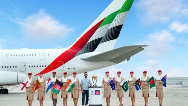 Dinesh Karthik with the ICC Cricket World Cup trophy Cricket fever is back with Emirates as Official Airline Partner of ICC Men’s Cricket World Cup 2023