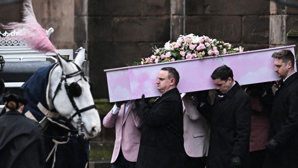 The coffin of murdered transgender teenager Brianna Ghey, is carried outside St Elphin's Church in Warrington, northern England. (Oli Scarff/ AFP)