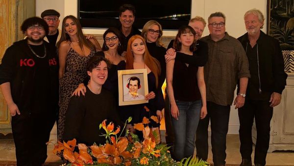 Modern Family cast pose with Ty Burrell aka Phil’s photo. (Sofia Vergara (@sofiavergara) on Instagram)