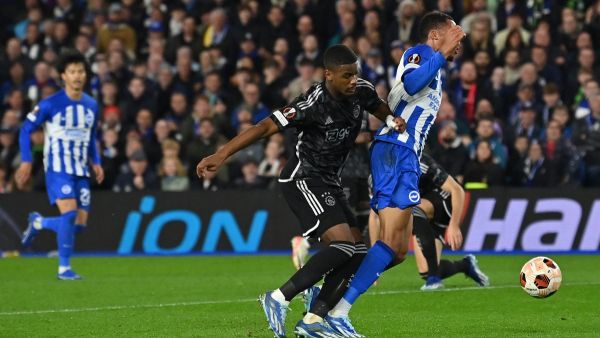 Ajax's Dutch defender #04 Jorrel Hato fouls Brighton's Brazilian striker #09 Joao Pedro during the UEFA Europa League Group B football match between Brighton and Hove Albion and Ajax at the American Express Community Stadium in Brighton, southern England on October 26, 2023. (Photo by Glyn KIRK / AFP)