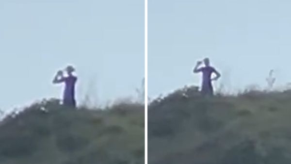 Tall alien-like creatures filmed roaming on hillside in Brazil. (X)