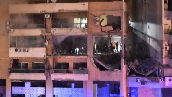People inspect the site of a strike, reported by Lebanese media to be an Israeli strike targeting a Hamas office, in the southern suburb of Beirut. (AFP) People inspect the site of a strike, reported by Lebanese media to be an Israeli strike targeting a Hamas office, in the southern suburb of Beirut. (AFP)