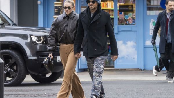 Gigi Hadid walk Bradley Cooper confirm their romance with a hand-holding stroll in London in first PDA photos. (X)
