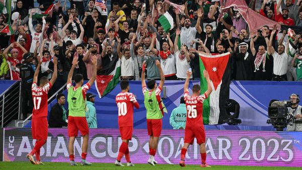 Jordan's players salute the attendance after the end of the Qatar 2023 AFC Asian Cup Group E football match between Malaysia and Jordan at the Al-Janoub Stadium in Al-Wakrah, south of Doha on January 15, 2024. (Photo by HECTOR RETAMAL / AFP)