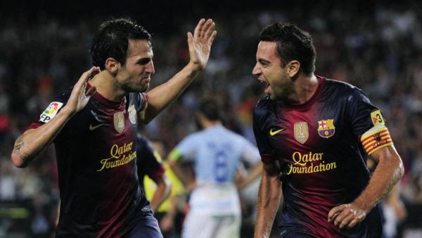 صورة أرشيفية لتشافي وسيسك (Photo by JOSEP LAGO / AFP)