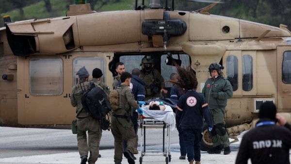 An Israeli medical team transports a peson wounded in a rocket attack fired from southern Lebanon at Ziv hospital in Israel's northern city of Safed on February 14, 2024. AFP