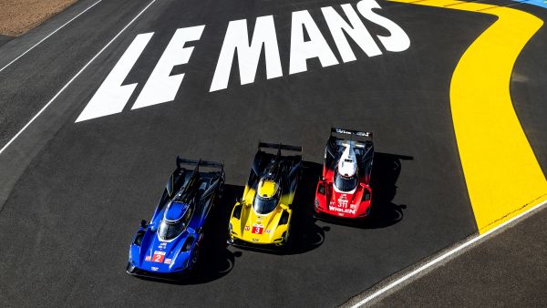Front overhead view of three Cadillac V-Series.R hybrid racecars on the track at Le Mans. Cadillac Racing Receives Three Invitations from Automobile Club de l’Ouest for the 2024 24 Hours of Le Mans