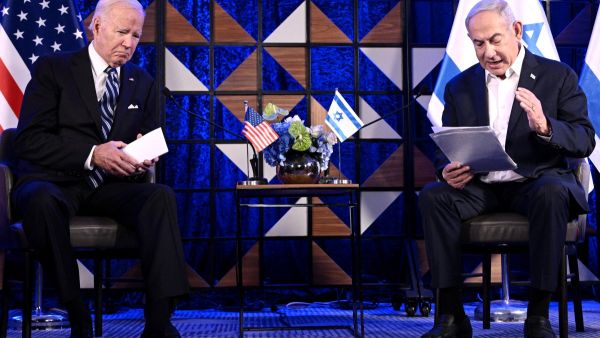 Israel's Prime Minister Benjamin Netanyahu reads a statement before their meeting in Tel Aviv on October 18, 2023, amid the ongoing battles between Israel and the Palestinian group Hamas. (Photo by Brendan Smialowski / AFP) Biden's plan to abandon Netanyahu
