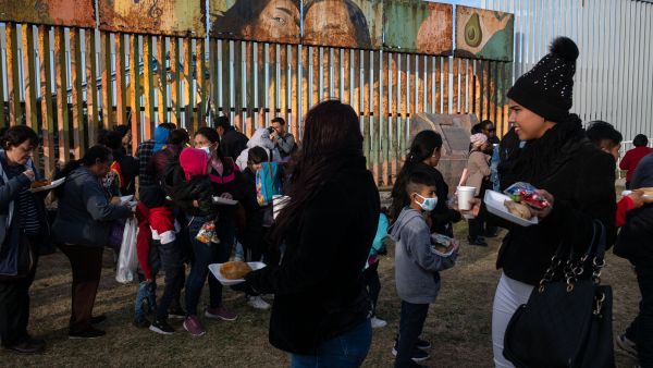 Religious, human rights, and civil society groups celebrate the 30th Posada Sin Fronteras (Posada Without Borders) organized by the Pro-Defense Migrant Coalition at the US-Mexico border in Playas de Tijuana, Baja California State, Mexico, on December 9, 2023.  (Photo by Guillermo Arias / AFP) Mexico borders