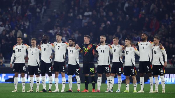 Germany's players observe a minute's silence for former German International players Franz Beckenbauer and Andreas Brehme, ahead of the friendly football match between France and Germany, at the Groupama Stadium in Decines-Charpieu, near Lyon, on March 23, 2024. (Photo by FRANCK FIFE / AFP)