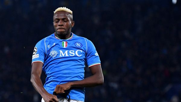 Napoli's Nigerian forward #09 Victor Osimhen celebrates after scoring a goal during the UEFA Champions League round of 16 first Leg football match between Napoli and Barcelona at the Diego-Armando-Maradona stadium in Naples on February 21, 2024. (Photo by Tiziana FABI / AFP)