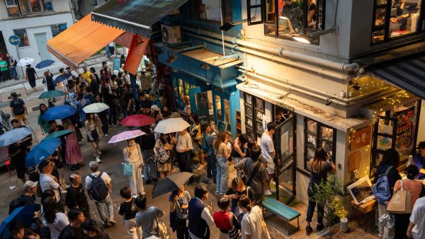 Visitors pay tribute to independent bookstore 'Mount Zero' on its last day of business in Hong Kong. Photo by Justin CHAN / AFP) bookstore