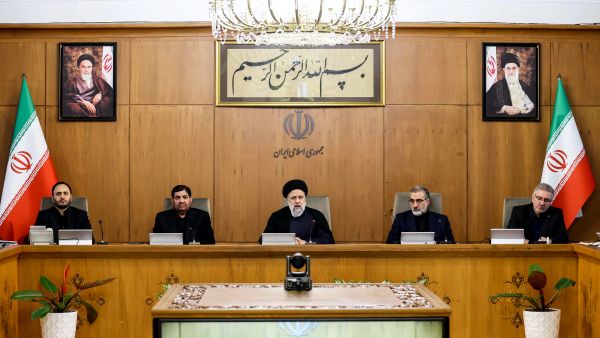 This handout picture provided by the Iranian president's office shows President Ebrahim Raisi (C) chairing a cabinet meeting in Tehran on April 2, 2024.