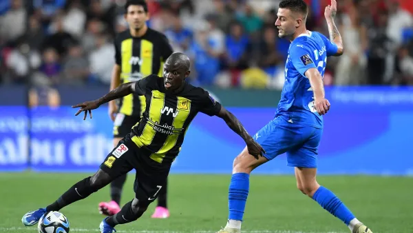 Ittihad's French midfielder #07 N'Golo Kante runs past Hilal's Serbian midfielder #22 Sergej Milinkovic-Savic during the Saudi Super Cup final football match between Al-Ittihad and Al-Hilal at the Mohammed bin Zayed Stadium in Abu Dhabi on April 11, 2024. (Photo by Ryan LIM / AFP)