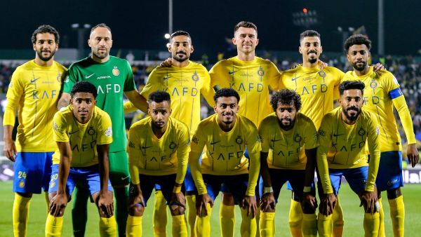Nassr's starting eleven pose for the group photo before the start of the Saudi Pro League football match between Damac FC and Al-Nassr FC at Prince Sultan bin Abdulaziz Sports City stadium in Abha on April 5, 2024. (Photo by Mohammed ALSHEHRI / AFP)