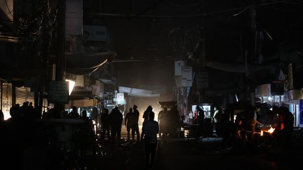 Palestinians walk in Rafah, in the southern Gaza Strip on May 4, 2024, amid the ongoing conflict between Israel and the militant Hamas group. (Photo by AFP) Rafah