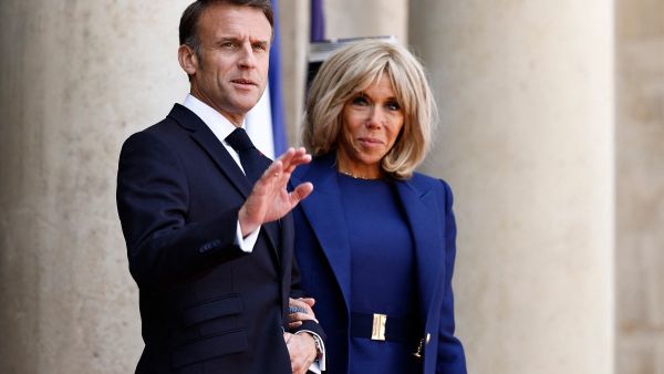 France's President Emmanuel Macron (L) and France's first lady Brigitte Macron wait upon the arrival of US President and US first lady ahead of a bilateral meeting as part of the US President's state visit to France, at the Presidential Elysee Palace in Paris on June 8, 2024. France's first lady Brigitte Macron