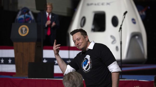 US President Donald Trump acknowledges SpaceX founder Elon Musk (R) after the successful launch of the SpaceX Falcon 9 rocket with the manned Crew Dragon spacecraft at the Kennedy Space Center on May 30, 2020 in Cape Canaveral, Florida. (Saul Martinez/Getty Images/AFP) US President Donald Trump