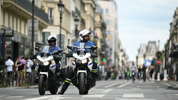 French police officers patrol on motorcycles in central Paris, on July 23, 2024, ahead of Paris 2024 Olympic and Paralympic Games. (Photo by Natalia KOLESNIKOVA / AFP) Paris