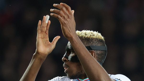 Napoli's Nigerian forward #09 Victor Osimhen claps during the UEFA Champions League last 16 second leg football match between FC Barcelona and SSC Napoli at the Estadi Olimpic Lluis Companys in Barcelona on March 12, 2024. (Photo by LLUIS GENE / AFP)