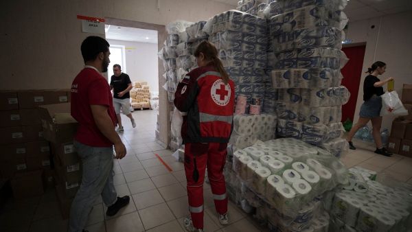 Volunteers sort out humanitarian aid at a Russian Red Cross distribution point in Kursk on August 15, 2024, following Ukraine's offensive into Russia's western Kursk region. Ukraine on August 15, 2024, claimed fresh advances in its cross-border offensive into Russia, where it said it had seized over a thousand square kilometres, the biggest attack by a foreign army on Russian soil since World War II. (Photo by TATYANA MAKEYEVA / AFP) Ukraine