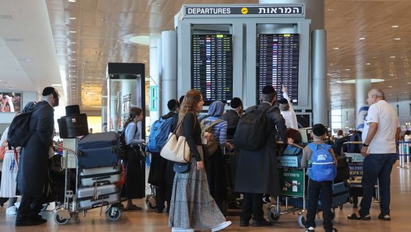 Passengers wait for flights at the Ben Gurion Airport in Tel Aviv during a nationwide strike on September 2, 2024.  (Photo by GIL COHEN-MAGEN / AFP) Ben Gurion Airport