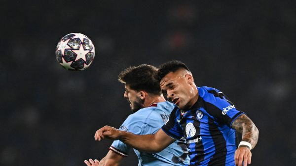 Manchester City's Portuguese defender #3 Ruben Dias (L) vies to header the abll against Inter Milan's Argentinian forward #10 Lautaro Martinez during the UEFA Champions League final football match between Inter Milan and Manchester City at the Ataturk Olympic Stadium in Istanbul, on June 10, 2023. (Photo by Paul ELLIS / AFP) Manchester City's Portuguese defender #3 Ruben Dias (L) vies to header the abll against Inter Milan's Argentinian forward #10 Lautaro Martinez during the UEFA Champions League final football match between Inter Milan and Manchester City at the Ataturk Olympic Stadium in Istanbul, on June 10, 2023. (Photo by Paul ELLIS / AFP)